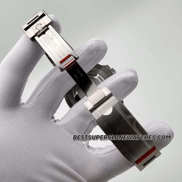 Fake Rolex Sea-Dweller watch with black dial, white luminous markers, and stainless steel bracelet