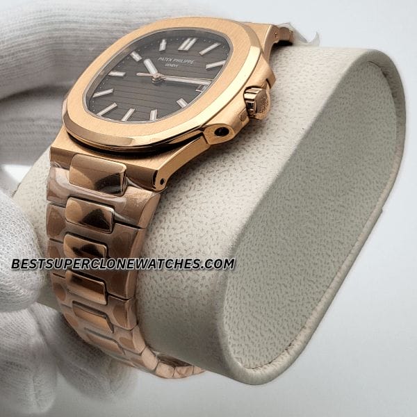 Fake Patek Philippe watch featuring brown horizontal embossed dial and gold hands