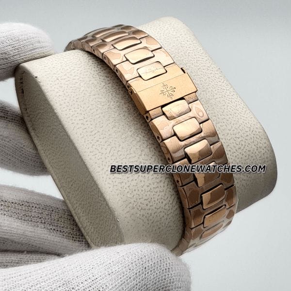 Replica Patek Philippe Nautilus watch in rose gold with brown dial and baton markers