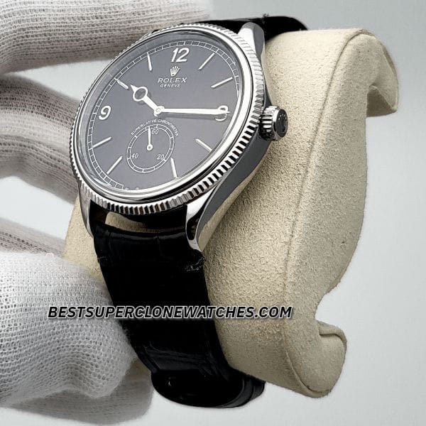 Replica Rolex 1908 18kt white gold with intense black dial and alligator strap, featuring 7140 movement clone