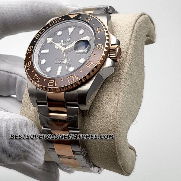 Luxury fake Rolex GMT Master II featuring Rootbeer brown and black bezel with 2-tone bracelet