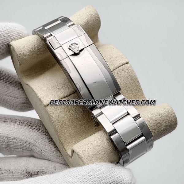 Side view of Swiss clone Rolex GMT Master II with polished steel case and black dial