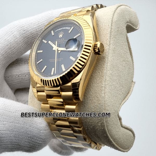 Close-up of replica Rolex Day-Date 228238 with polished yellow gold case and black dial