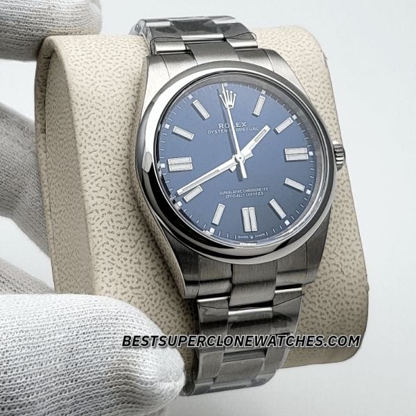 High-quality replica Rolex Oyster Perpetual featuring bright blue dial, luminous markers, and steel case