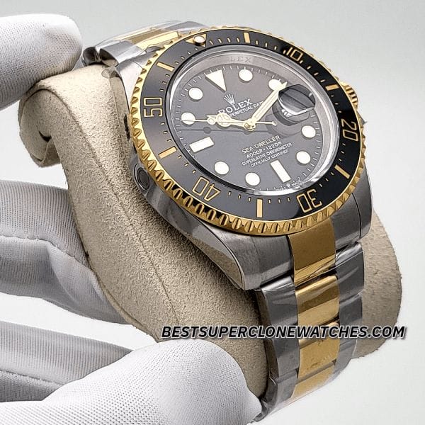 Fake Rolex Sea-Dweller watch with black dial, yellow gold accents, and automatic 3235 movement imitation